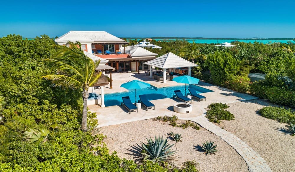 Pool cabana with Chalk Sound behind