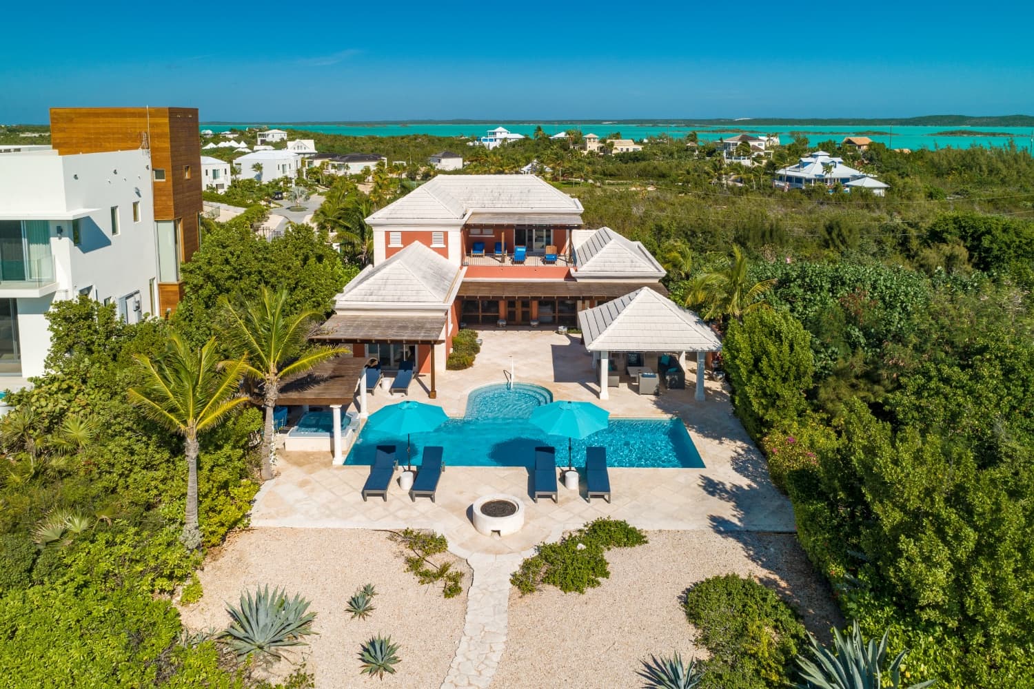 Pool and house with Chalk Sound backdrop