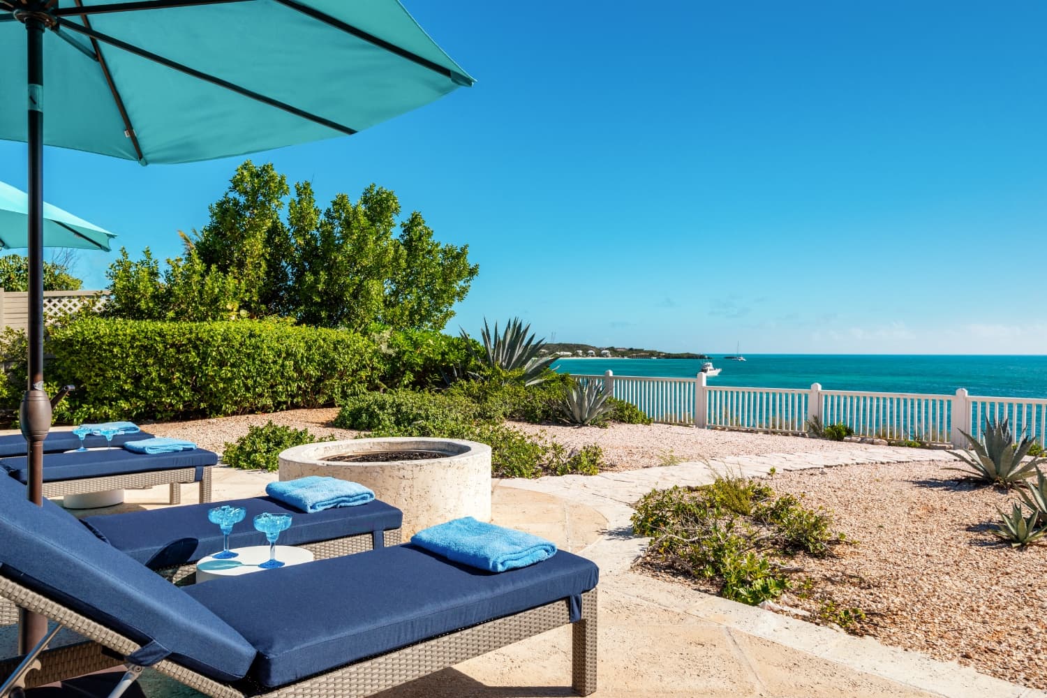 Lounge chairs with landscaping and Sapodilla Bay